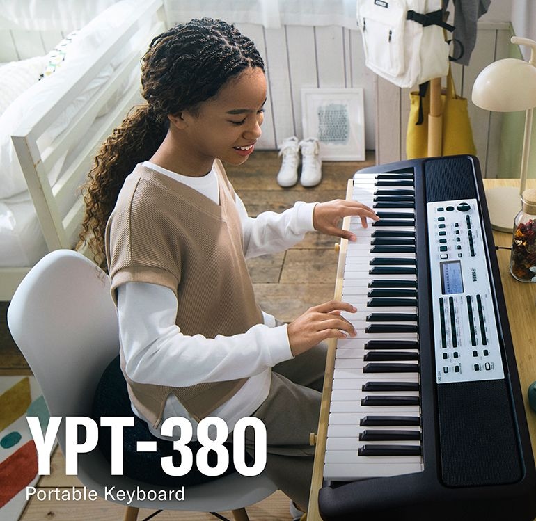 A girl playing the YPT-380