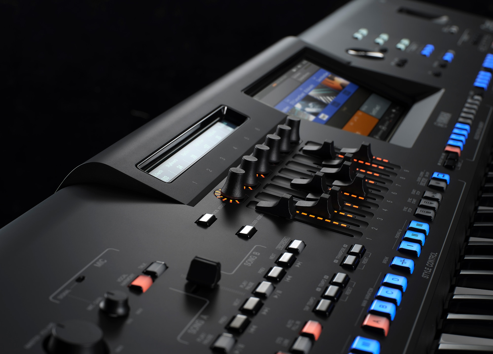 The Genos2 sub-display, main display and knobs, and slider area, taken from the left.