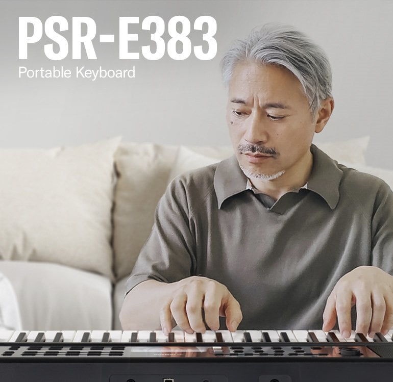 The man is playing the PSR-E383 enthusiastically.